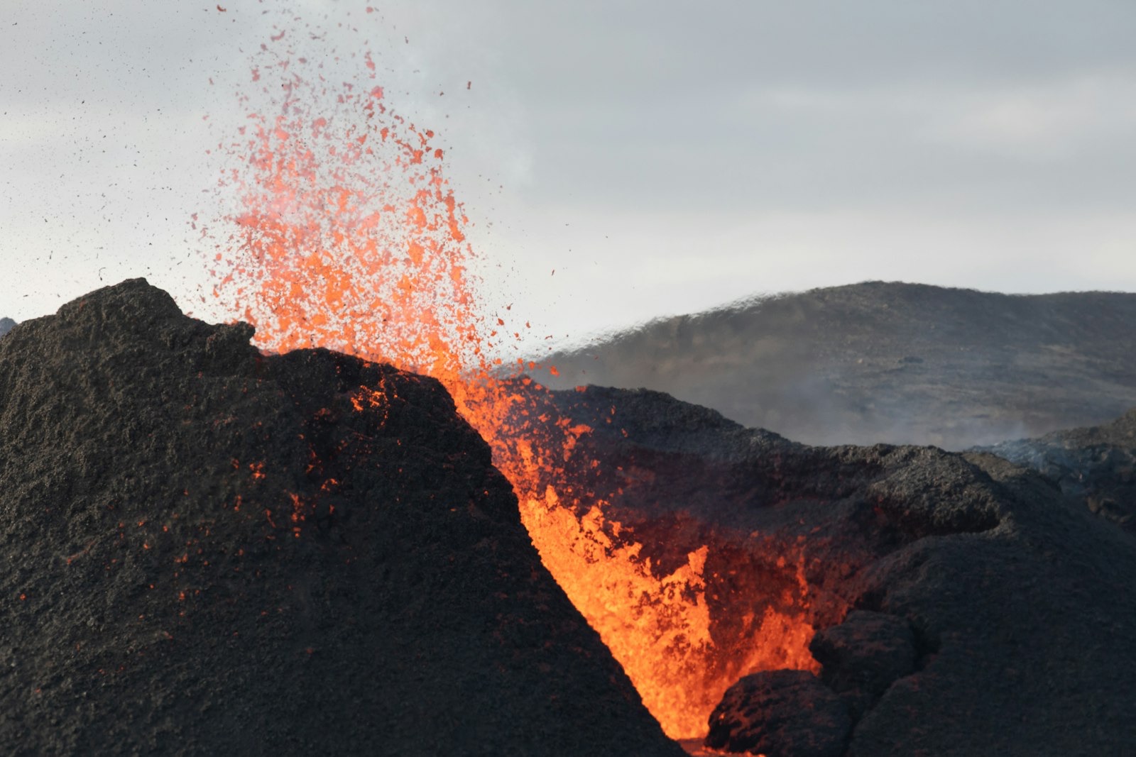 Lava fountaining from a black cinder cone during the 2021 eruption at Geldingadalur on the Reykjanes peninsula